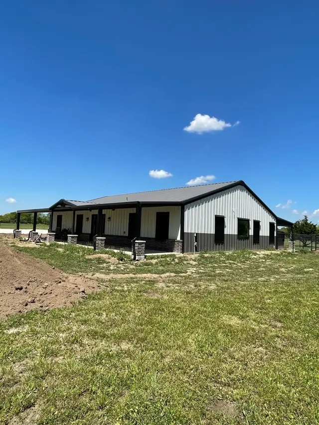 Barndominium-style metal building with a covered porch