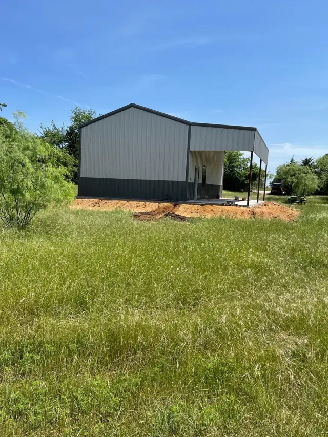 Metal building with a covered side porch