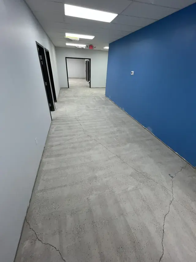 Office suite corridor with a blue accent wall