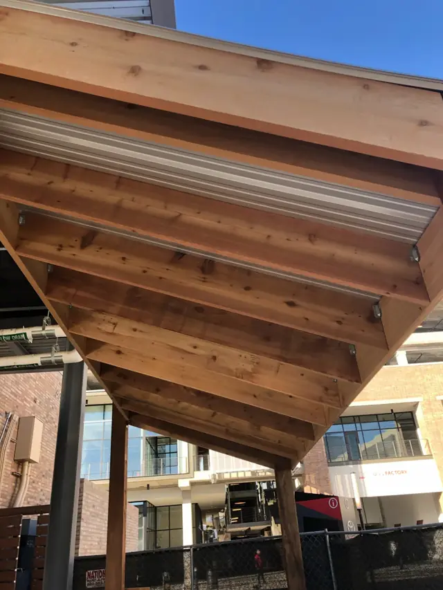 Cedar pergola beams from below