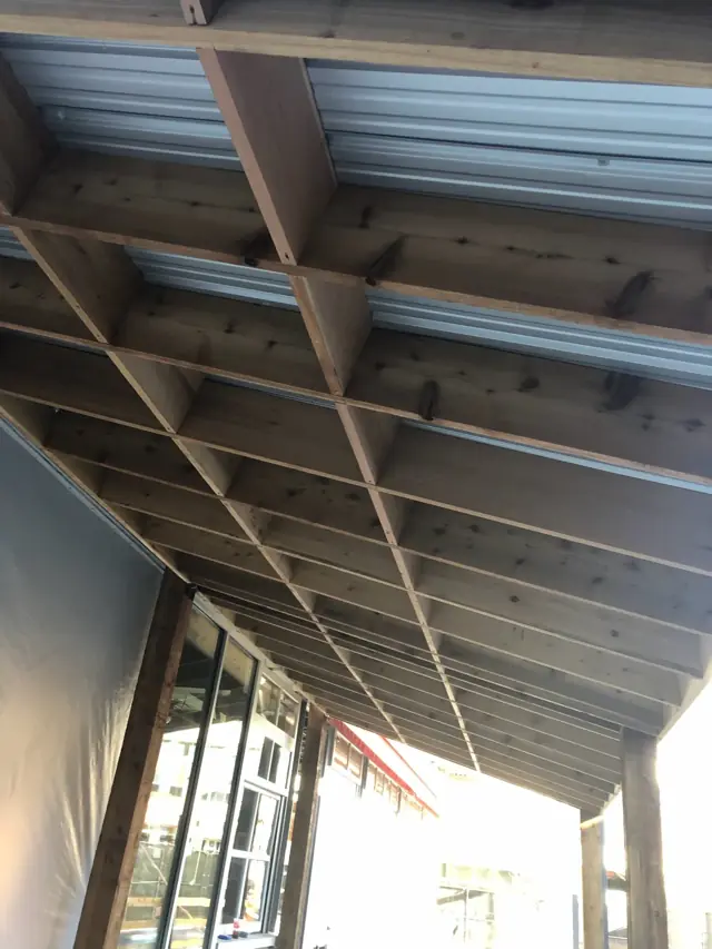 Cedar canopy over a storefront walkway
