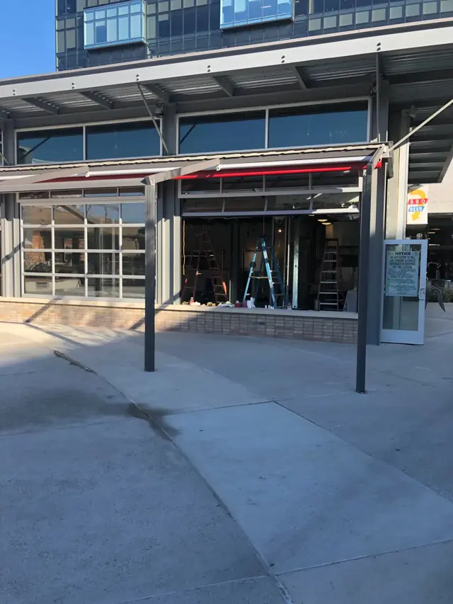 Retail storefronts with a steel canopy
